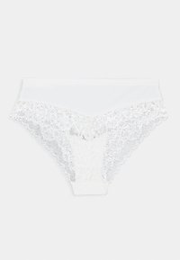 Culotte en dentelle blanche avec une taille lisse et une bordure en dentelle florale sur les bords. La dentelle présente un motif festonné avec un léger éclat.