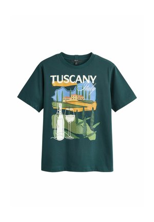 Green cotton t-shirt featuring a Tuscan landscape graphic with a bottle and glasses, printed text, short sleeves, and a crew neck design.