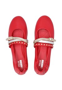 Red leather Mary Jane shoes with a round toe, featuring a metallic gold strap and studded accents. Smooth texture with a flat sole.