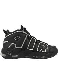 Zapatilla negra Nike Air More Uptempo con grandes letras "AIR" en el lateral y amortiguación de aire visible en la suela.