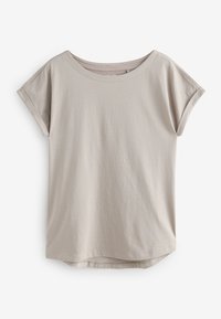 T-shirt beige en coton oversize à manches courtes avec poignets retroussés et col rond, présenté sur fond blanc.