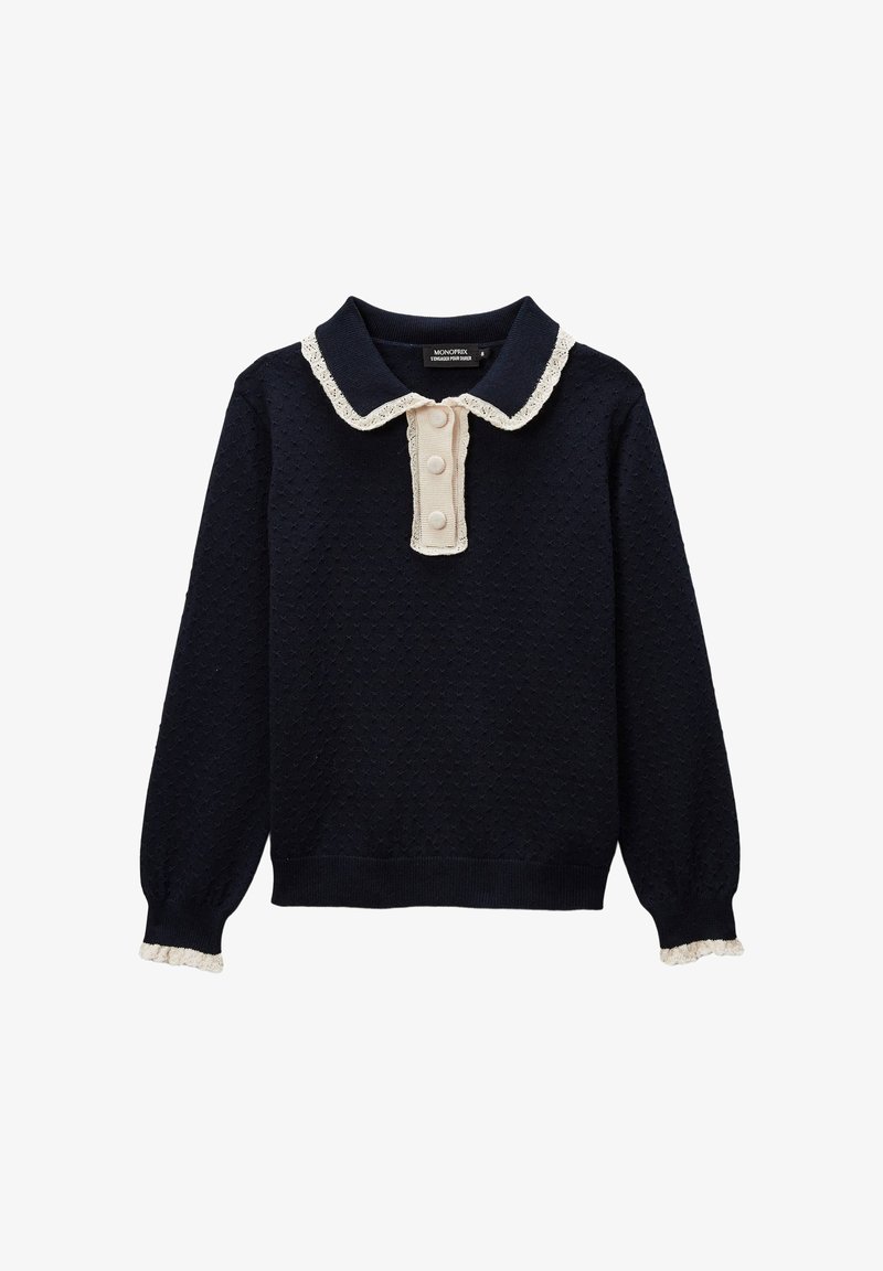 Pull-over en tricot marine avec motif texturé, col crème et trois boutons au cou. Accents froncés au niveau du col et des poignets.