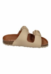 Beige leather slide sandal featuring two knotted straps, a cork sole, and a textured outsole for traction. Interior in warm brown.