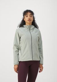 Lichtgroene, ritsjack met capuchon, gemaakt van een glad, waterafstotend materiaal, met zijzakken en een subtiele logodetail.
