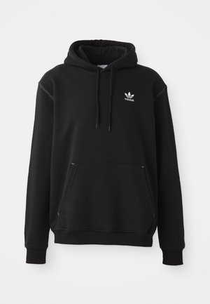 Fekete pamut kapucnis pulóver kenguruzsebbel, fehér Adidas logóval, bordázott mandzsettákkal és szegéllyel, húzózsinórral ellátott kapucnival és varrott részletekkel.