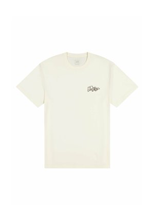 Maglietta in cotone color crema con maniche corte, scollo rotondo e piccolo logo stampato sull'area sinistra del petto. Tessuto liscio e vestibilità comoda.