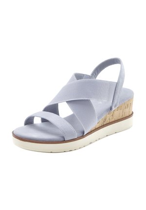Light blue wedge sandal with crisscross elastic straps, open toe, slingback, cork heel, and white rubber sole.