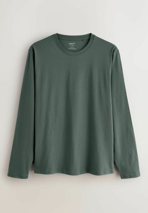 Langsleeve shirt in donkergroen, gemaakt van zachte stof. Heeft een ronde halslijn en een rechte zoom zonder zichtbare patronen of accenten.
