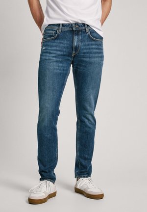 Vaqueros tapered - raw denim