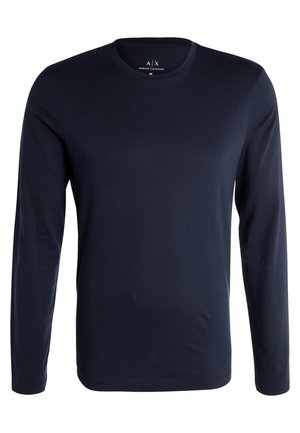 Camicia a maniche lunghe di colore blu navy realizzata in morbido tessuto, con collo a giro e design minimalista privo di motivi o dettagli.