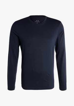 Långärmad skjorta i marinblått tyg av mjuk kvalitet, med rund hals och minimalistisk design utan mönster eller accentuerande detaljer.