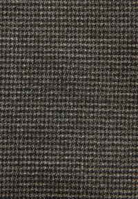 Textilmaterial med en texturerad vävd design i nyanser av mörkgrått och ljusbeige, med ett rutat mönster och en mjuk yta.