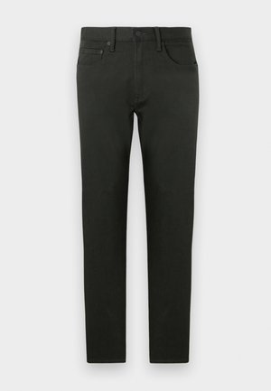 Pantaloni in cotone verde scuro con vestibilità slim. Presentano gamba dritta, tasche frontali e chiusura con bottone. Tessuto morbido, dettagli minimi.