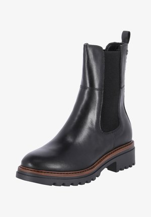Bottine en cuir noir avec panneaux latéraux élastiques, bout rond, semelle en caoutchouc robuste et surpiqûres contrastantes marron le long du bord de la semelle.