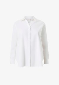 Camisa blanca de manga larga con botones, cuello y puños, con un ajuste ligeramente holgado y dobladillo curvo.
