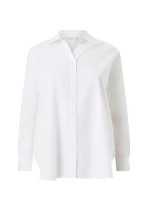 Hvid langærmet skjorte med knapper, krave og manchetter, der har en let løs pasform og en buet kant.