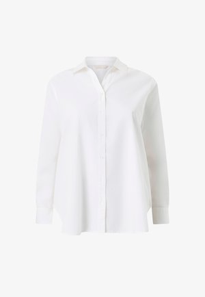 Wit overhemd met lange mouwen, knopen, kraag en manchetten, met een iets losse pasvorm en een afgeronde zoom.