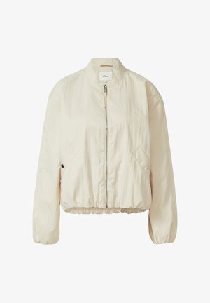 Blouson aviateur beige clair à fermeture éclair, avec taille élastique, deux poches latérales à boutons-pression et col montant, en tissu léger.