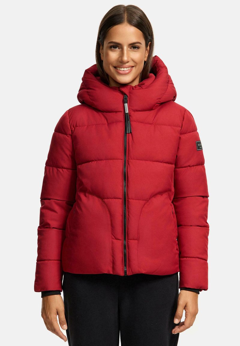 Red padded jacket with a large hood, front zipper, and side pockets. Features a quilted design and a black logo patch on the sleeve.