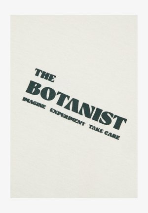 White fabric featuring the text "THE BOTANIST" in dark green bold font, with smaller text "IMAGINE EXPERIMENT TAKE CARE" beneath.