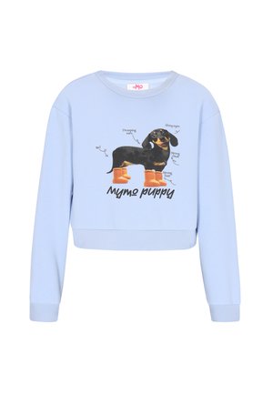 Sudadera corta azul claro con una imagen gráfica de un Dachshund con botas naranjas, etiquetado con frases descriptivas sobre sus características.
