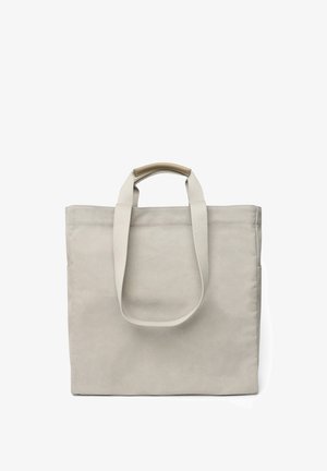 Borsa tote in tela beige con due manici lunghi, forma rettangolare e superficie liscia; presenta un accento di colore contrastante sui manici superiori.