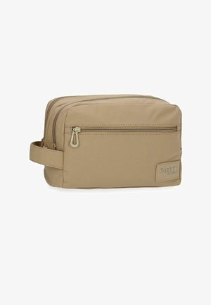 Neceser beige Reebok Classic con dos compartimentos con cremallera, bolsillo delantero con cremallera y correa lateral para llevar.