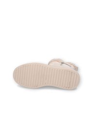 Helle rosa Stiefel mit einer strukturierten Gummisohle, seitlichem Reißverschluss, weicher Innenauskleidung und runder Form. Die Außensohle verfügt über vertikale Rillen.