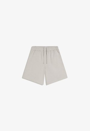 Lyse beige afslappede shorts med elastisk talje og snor, sidelommer og vidt ben-design.