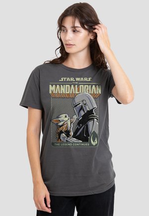 Gray cotton T-shirt featuring a graphic print of The Mandalorian and a character resembling a small creature, with bold text and a vintage style.