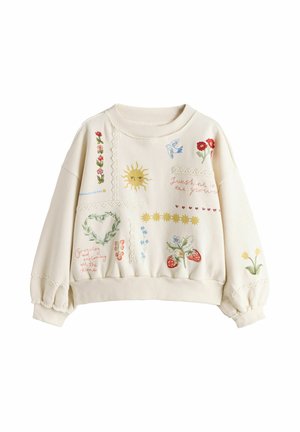 Cream sweatshirt with embroidered sun, flowers, birds, strawberries, and phrases like "Sunshine in the glow" and "Growing and exploring all the time."