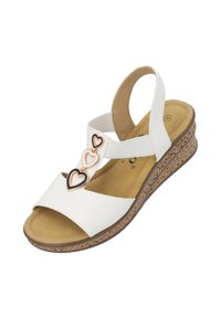 Sandaletta bianca con suola in sughero testurizzato. Presenta un design a strap con tre accenti a forma di cuore intrecciati in oro e nero. Soletta morbida.