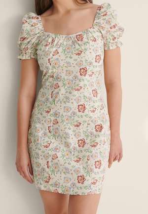 Blomstermønstret minikjole i cremefarvet stof, med puffærmer, firkantet udskæring og multicolor blomstermotiver med grønne blade.