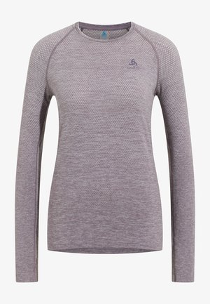 Long-sleeve athletic shirt in light mauve with textured fabric, round neck, and a small logo on the upper left side.