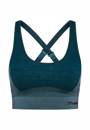 Mörk teal sportbehå med korsryggslingor, texturerad tyg och stödjande design. Har ett brett elastiskt band i botten.