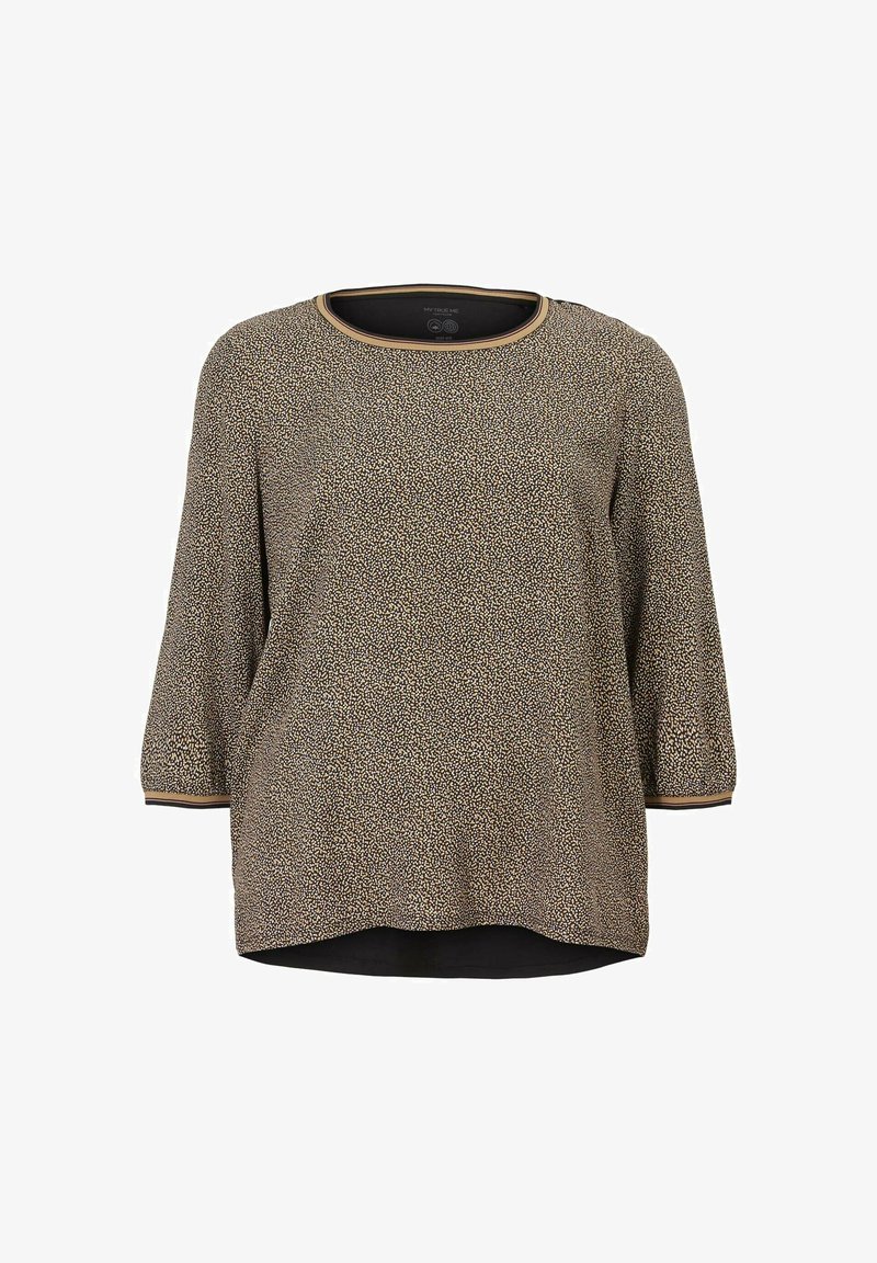 T-shirt à manches longues avec un motif tacheté noir et crème, un col rond avec une bordure dorée, et un ourlet incurvé pour une coupe décontractée.