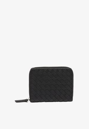 Black leather wallet with woven texture, rectangular shape, and zipper closure. Features a small leather tag on the side.