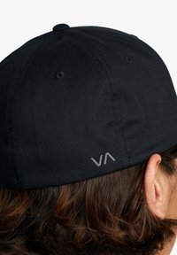 Black cap with a curved brim, showing a textured fabric surface. Features an embroidered "VA" logo in gray on the back.