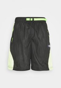 Svarta badshorts med rutmönster och gröna accenter. Har ventilerande mesh-paneler på sidorna och en elastisk midja med justerbar spänne.