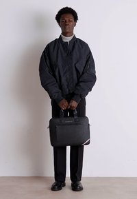 Tommy Hilfiger CENTRAL SLIM COMPUTER BAG UNISEX - Geantă laptop - black