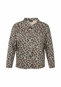 Beige blouse met luipaardprint, met zwarte en bruine vlekken, voorzien van een knoopsluiting aan de voorkant, lange mouwen en twee borstzakken.