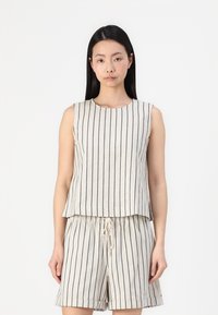 Linen blend, sleeveless top and shorts set in beige with navy vertical stripes. Features a round neck and an elastic waistband with drawstring.