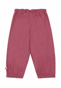 Elastische taillebroek in een effen rozenkleur, gemaakt van een zachte stof. Beschikt over gerimpelde manchetten bij de enkels en een klein veelkleurig label aan de zijkant.