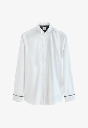 Biela košeľa s dlhým rukávom a gombíkmi, s mandarínským golierom a čiernym lemom na manžetách, vystavená na bielom pozadí.