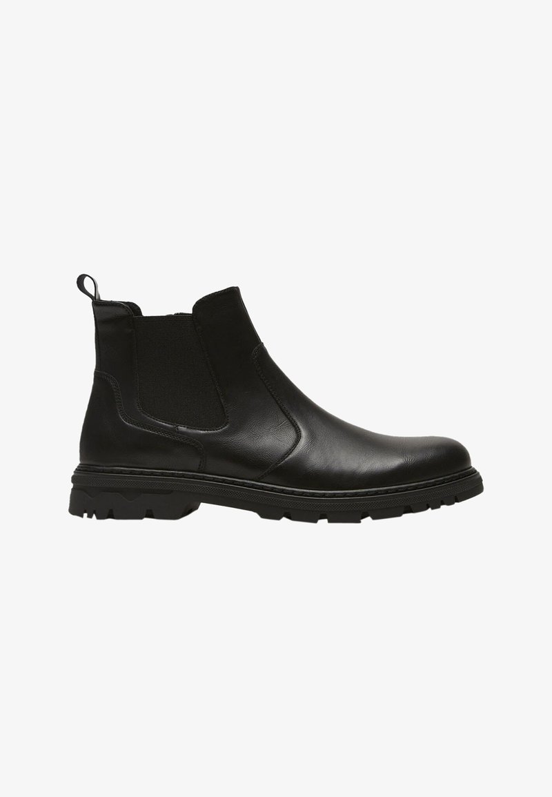 Bottines noires en cuir avec panneaux latéraux en elástico, tirant, surface texturée et semelle en caoutchouc robuste pour une meilleure adhérence. Design classique des Chelsea boots.