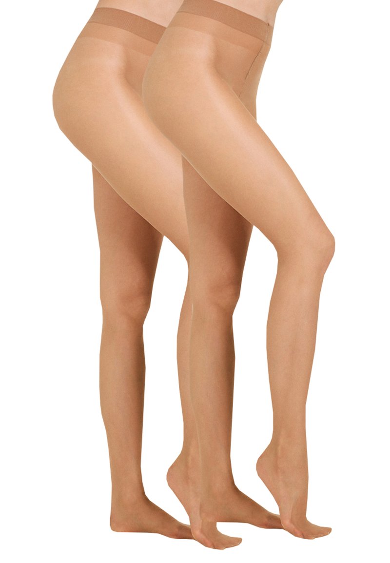 Collants transparents nude avec une texture lisse, une taille haute et une finition transparente, présentant un design léger et flexible.
