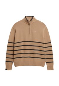 Beżowy sweter z dzianiny z prążkowanym kołnierzem, zamkiem błyskawicznym i czarnymi poziomymi paskami na ciele. Zawiera małe logo na klatce piersiowej.