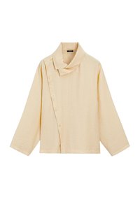 Beige top met lange mouwen en asymmetrische knoopsluiting en brede kraag, gemaakt van gestructureerde stof.