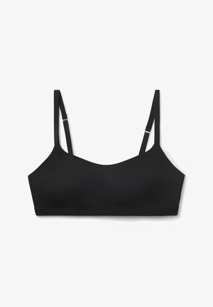 Zwarte bralette met verstelbare bandjes, naadloos ontwerp en een zachte, gestructureerde stof. Eenvoudige silhouet zonder hardware of versieringen.