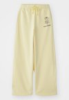 PUUSKA VIHKIRUUSU PLACEMENT JOGGERS UNISEX - Tréningruha alsók - light yellow/dark brown